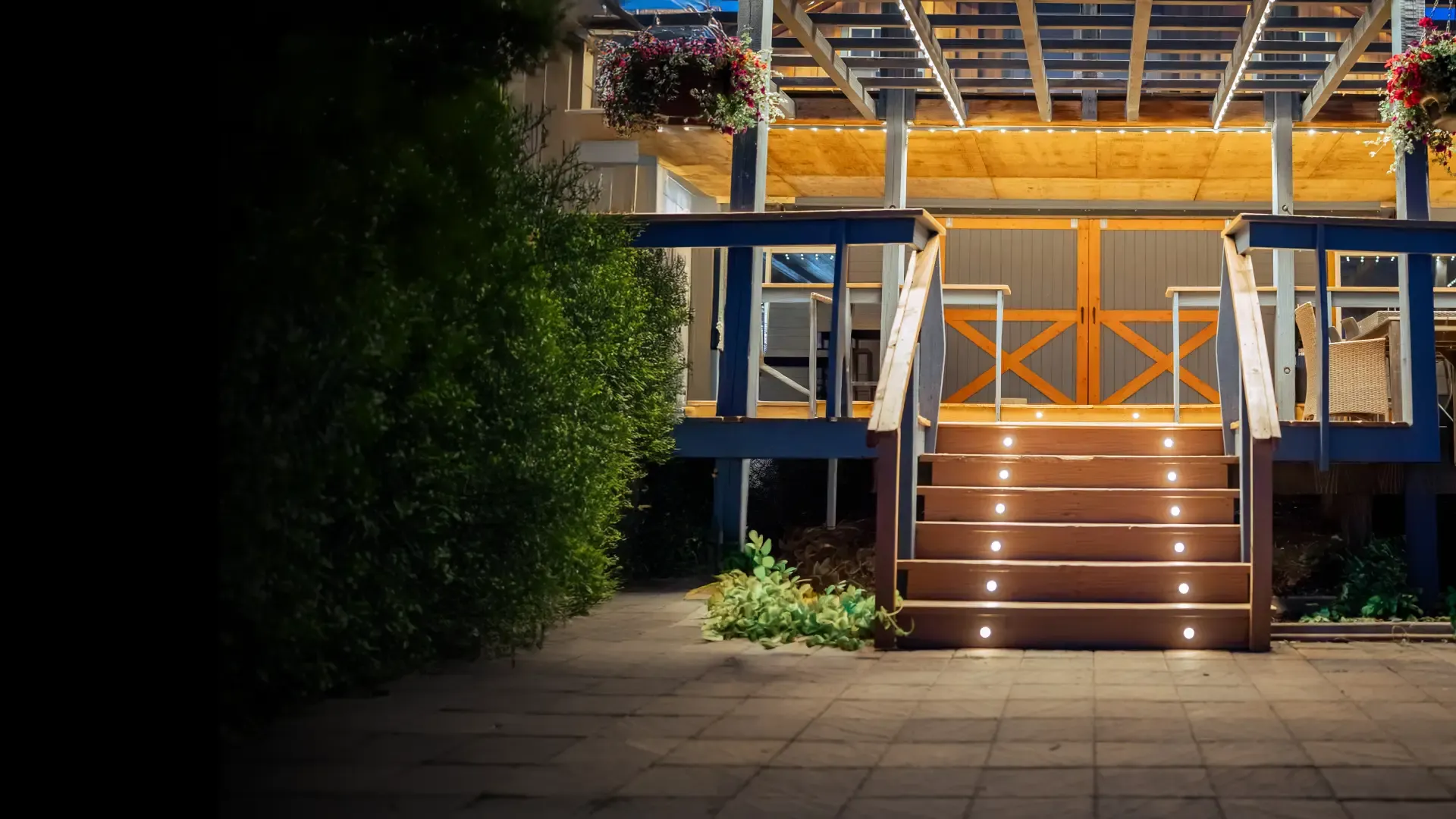 Back deck at night with small warm lights set into each stair