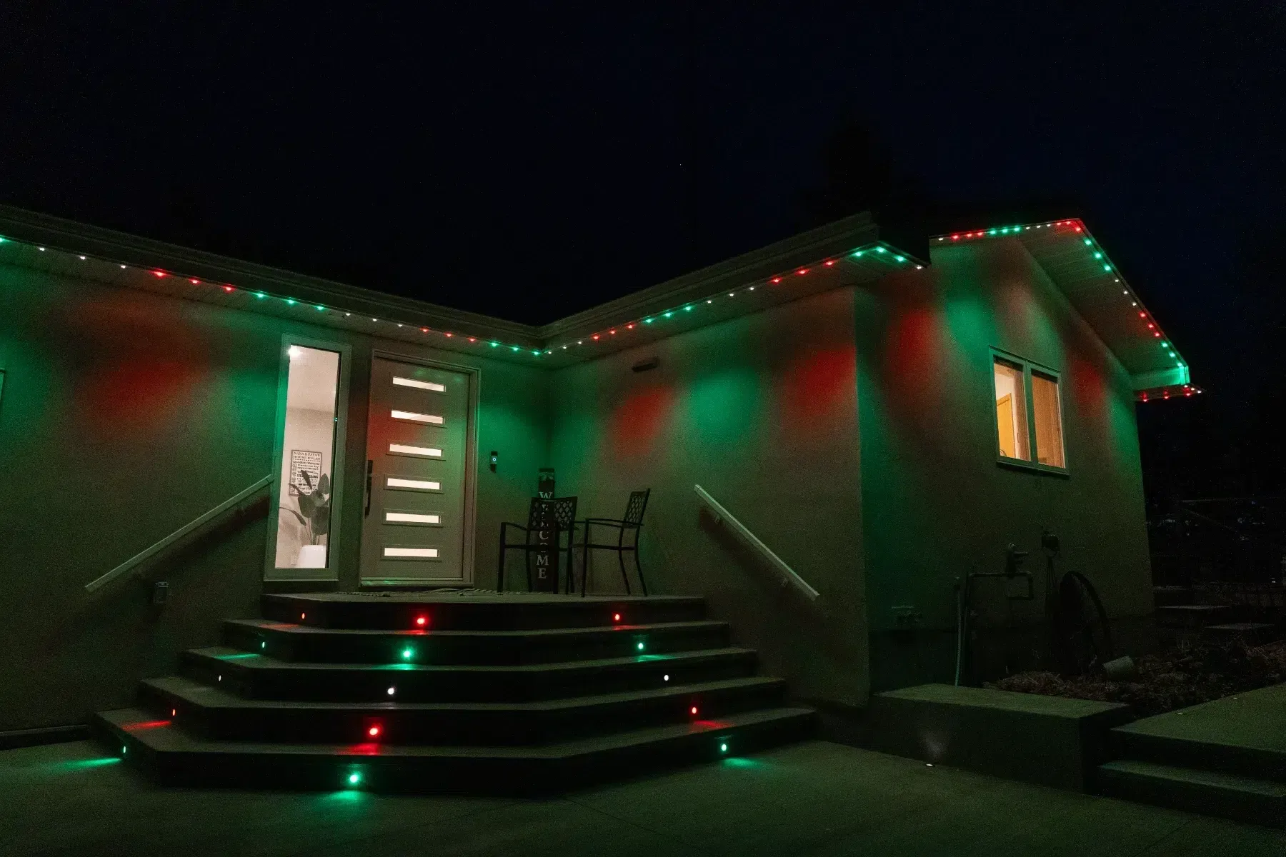 The same stairs lit red and green