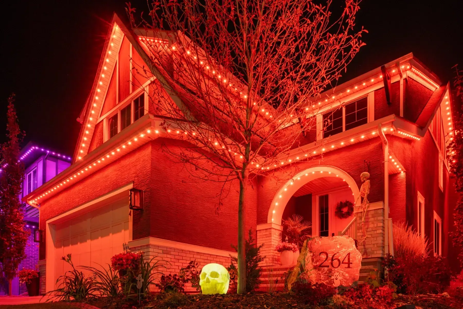 Two-storey house washed in orange and red