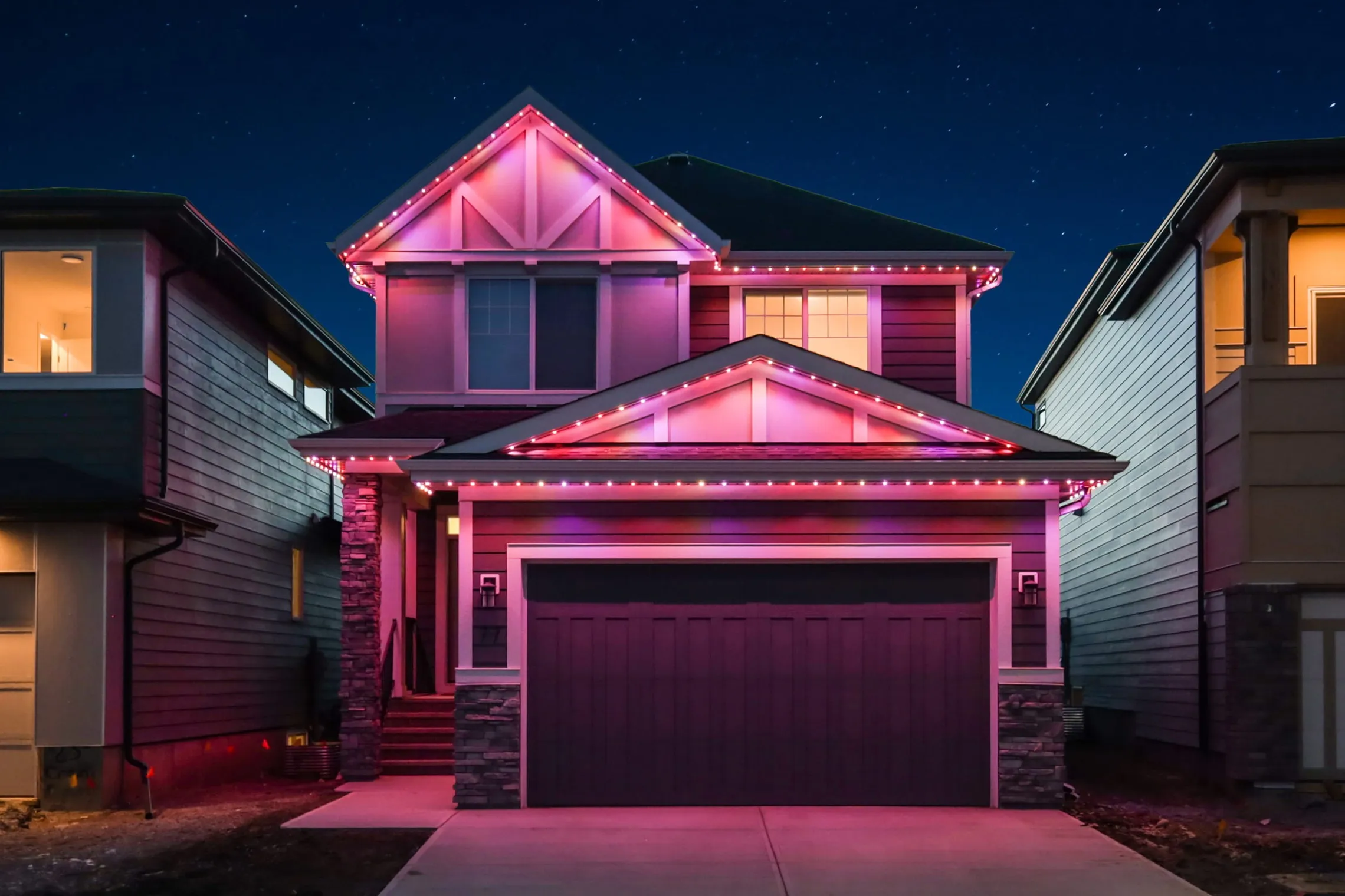 Two-storey house in hot pink and red